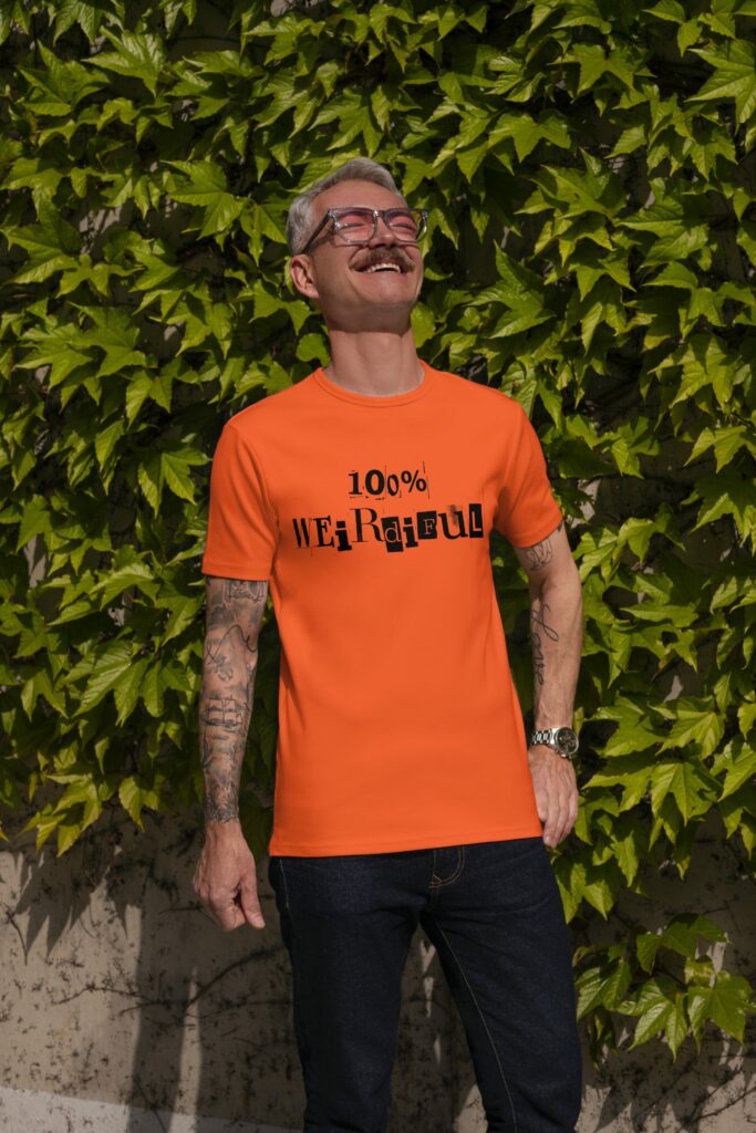 man, 100 percent weirdiful tshirt, basking in sunshine, smiling